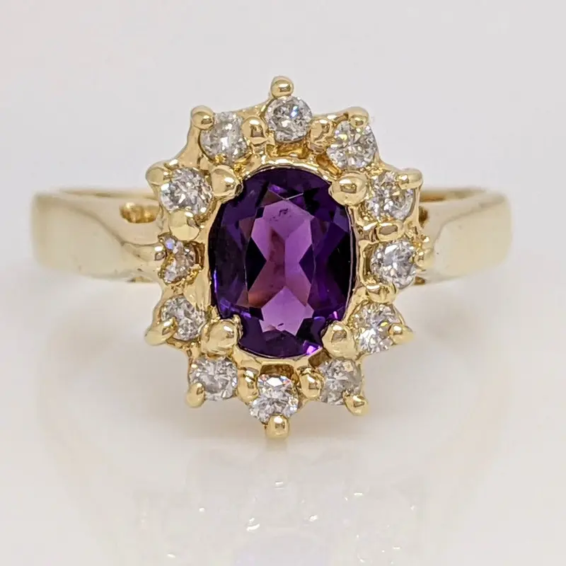 14K AMETHYST OVAL 5X7 WITH .24 DIAMOND TOTAL WEIGHT (12) ESTATE RING 4.6 GRAMS